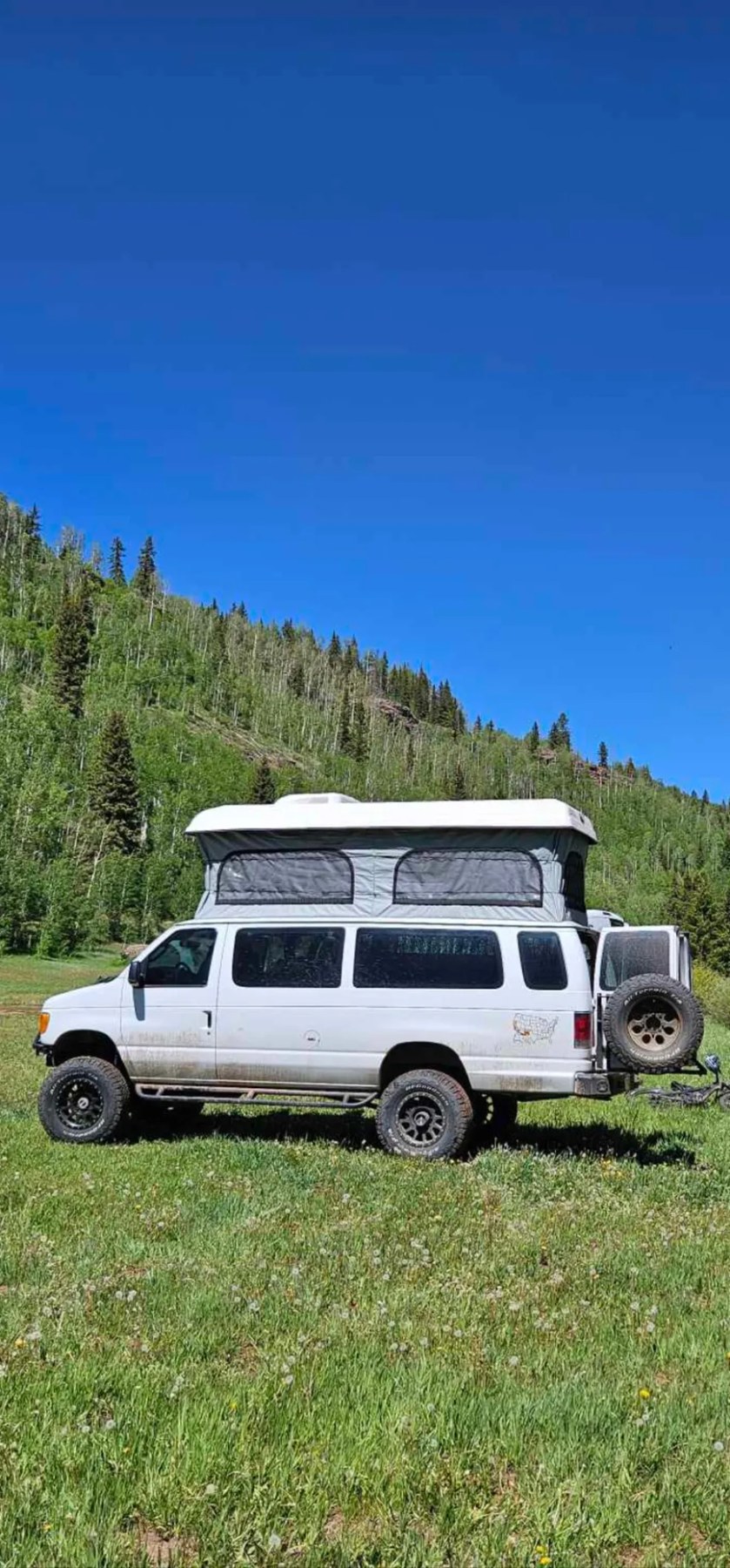 Pop-top Ford E-Series camper van