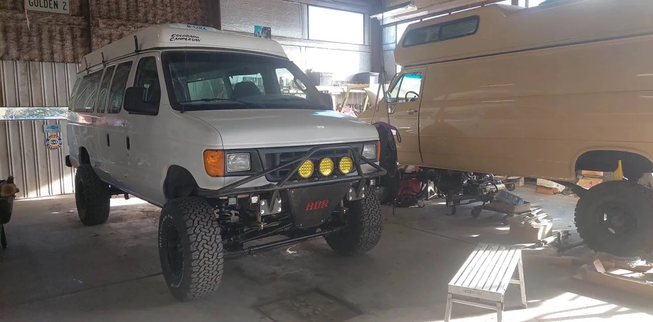 Two custom 4x4 vans in the Alpine shop
